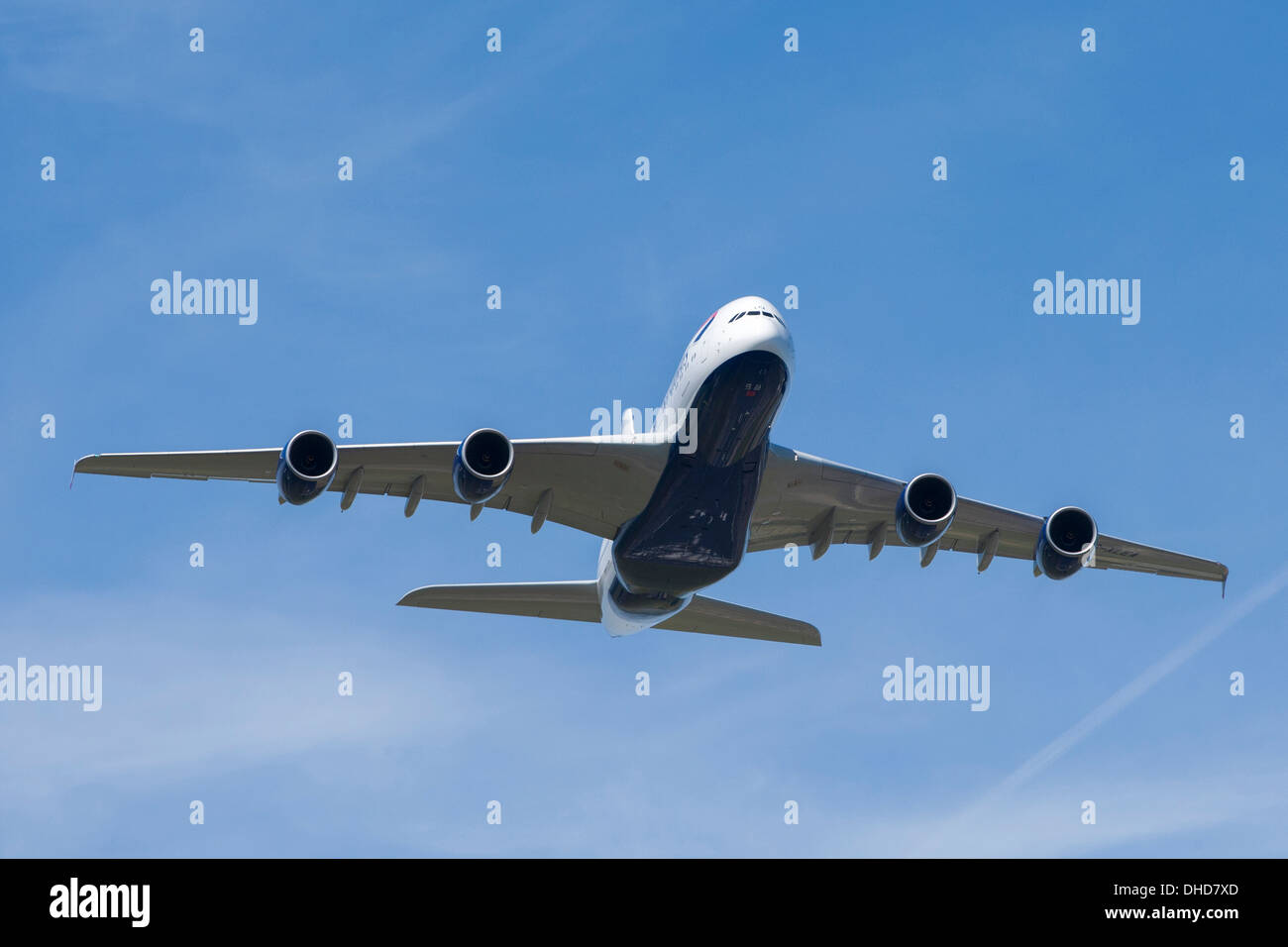 Airbus A380 Aircraft passenger airliner coming in to land against blue sky and wispy clouds. Stock Photo
