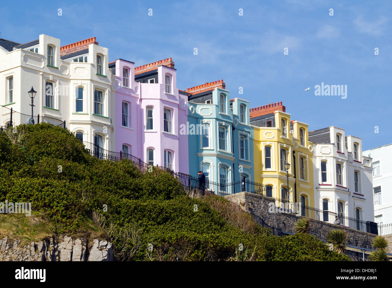 Vibrant pastel coloured guest houses on the cliff top at Tenby, Pembrokeshire, Wales, UK Stock Photo