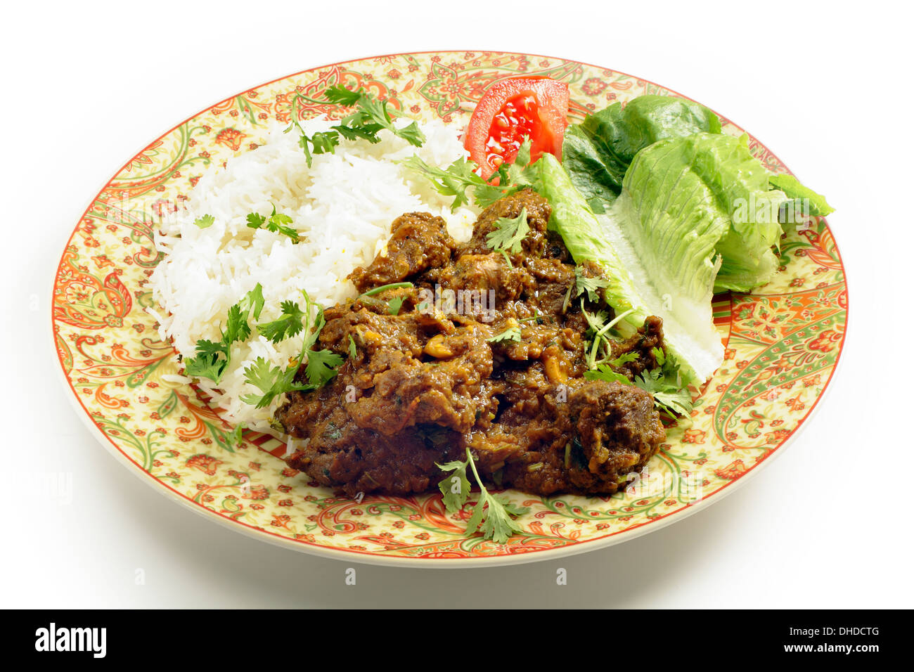 North Indian or Pakistani style bhuna ghosht, a fairly dry lamb curry, served with rice and a salad Stock Photo