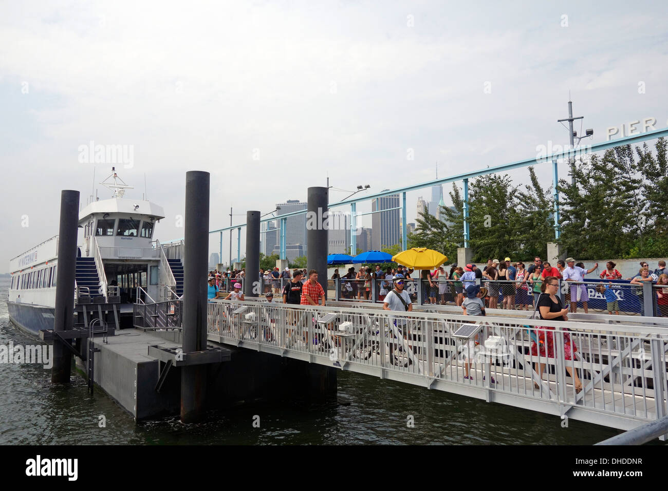 crowd waiting in line for ferry to Governors island Stock Photo