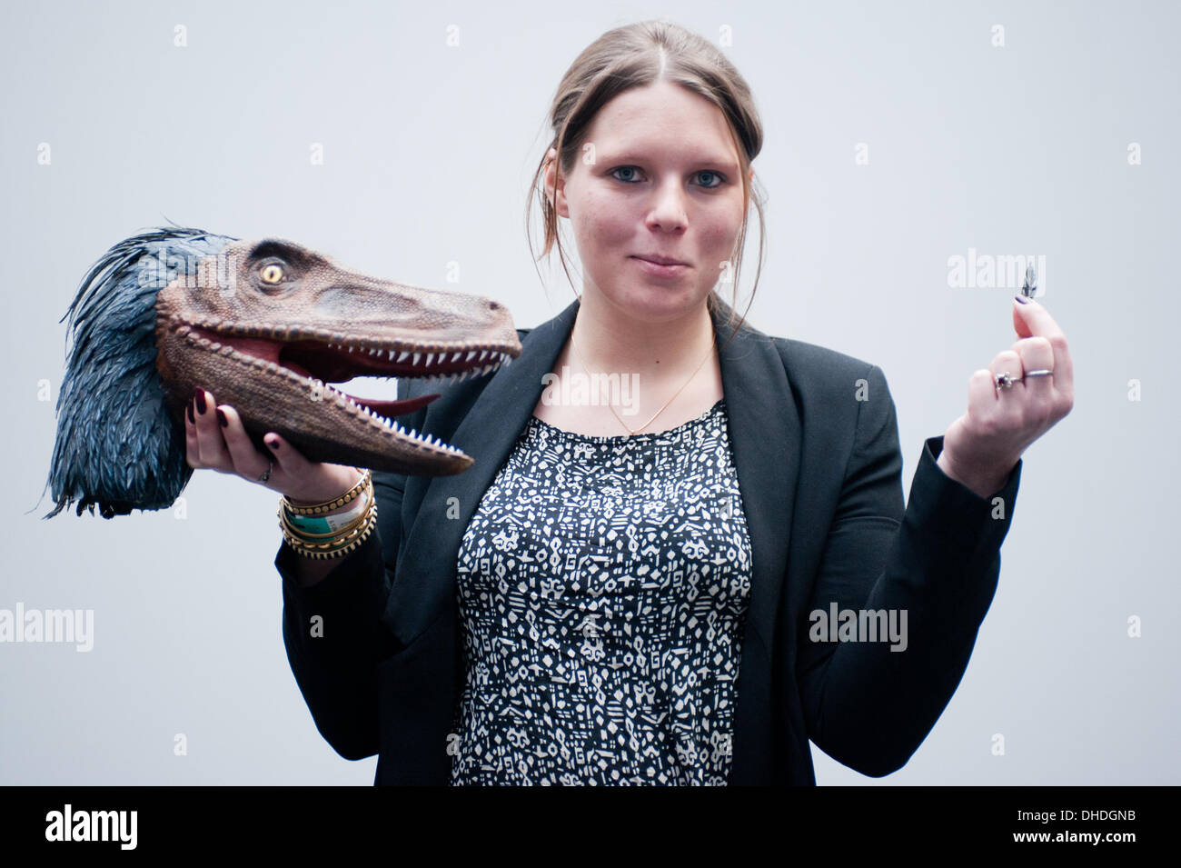 London, UK. 7th November 2013. Cyrielle Langiaux of Crea' Zaurus 3D shows a Velociraptor head, printed by Arketyp 3D, at the 3D Printshow at the Business Design Centre in London. Credit:  Piero Cruciatti/Alamy Live News Stock Photo