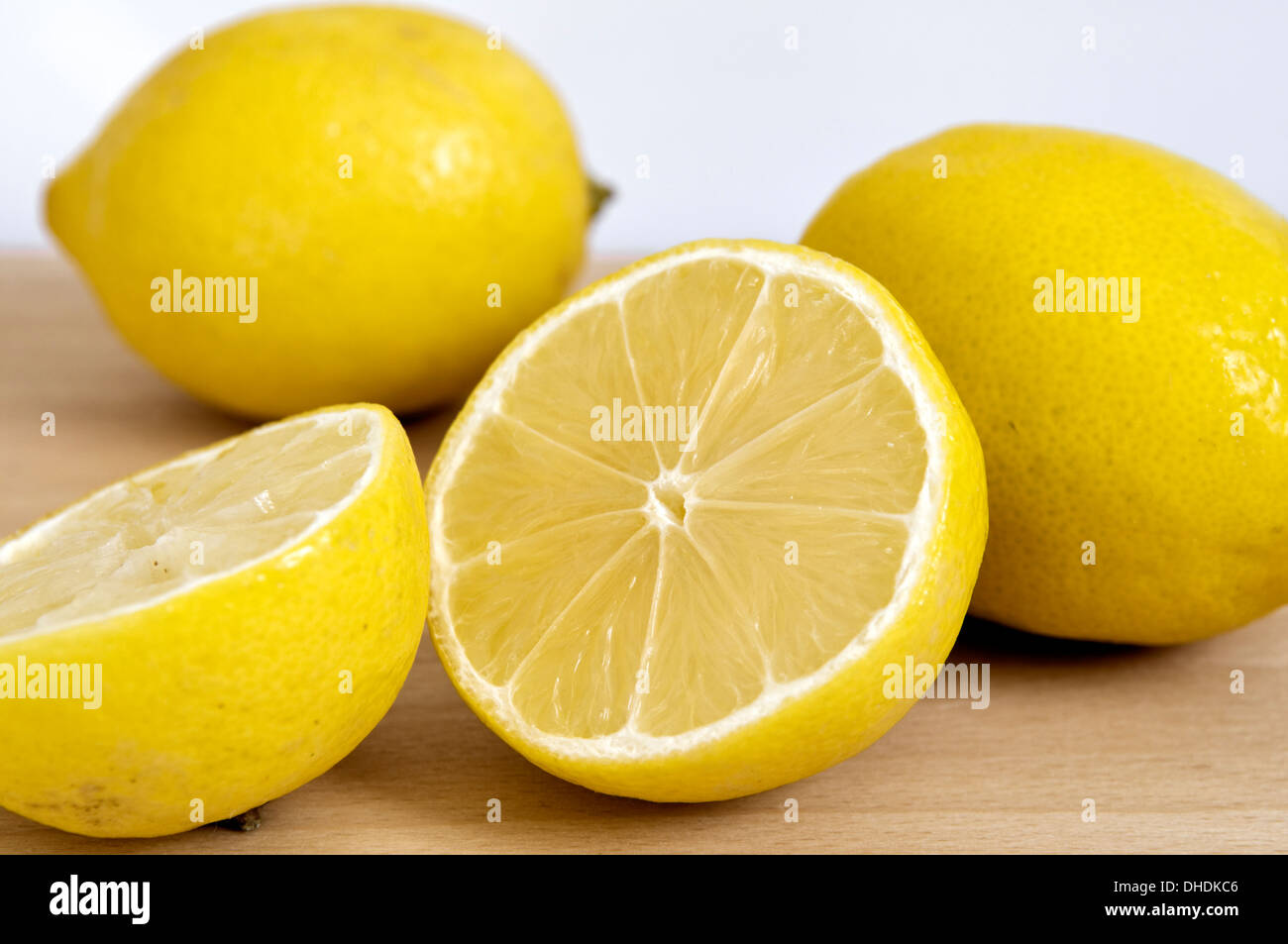 Close up of fresh lemons on table top Stock Photo