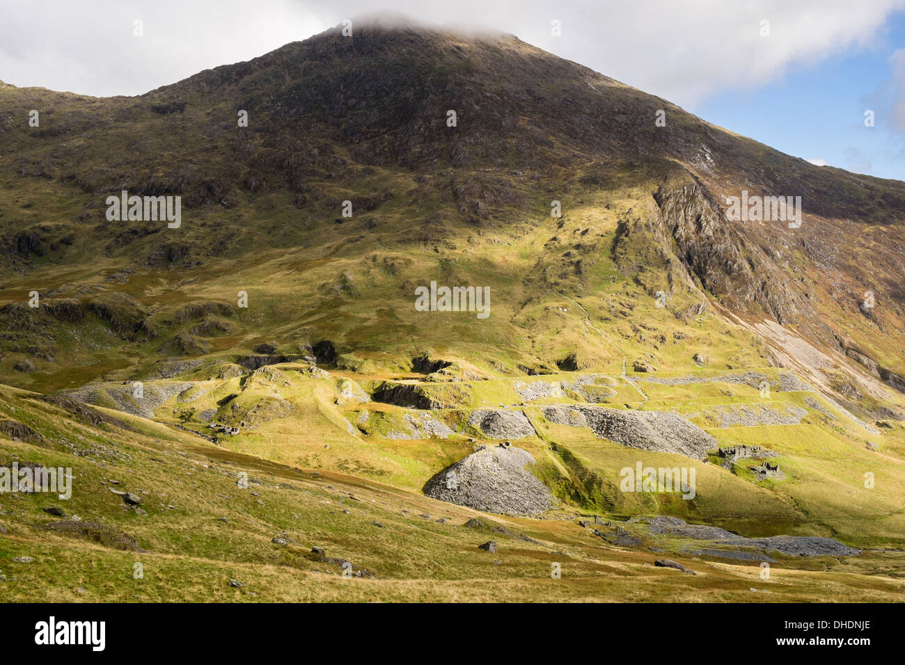 View across Cwm Llan to slag heaps from old disused South Snowdon slate quarry on slopes of Y Lliwedd in Snowdonia, Wales, UK Stock Photo