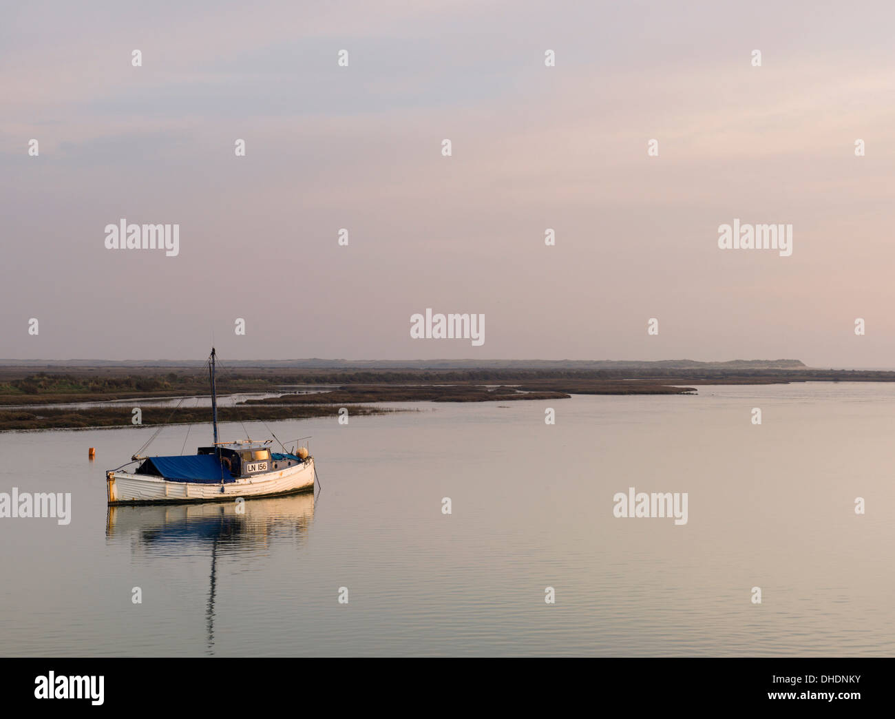 A loan boat in the tidal channel at Burnham Overy Staithe, Norfolk, England, United Kingdom, Europe Stock Photo