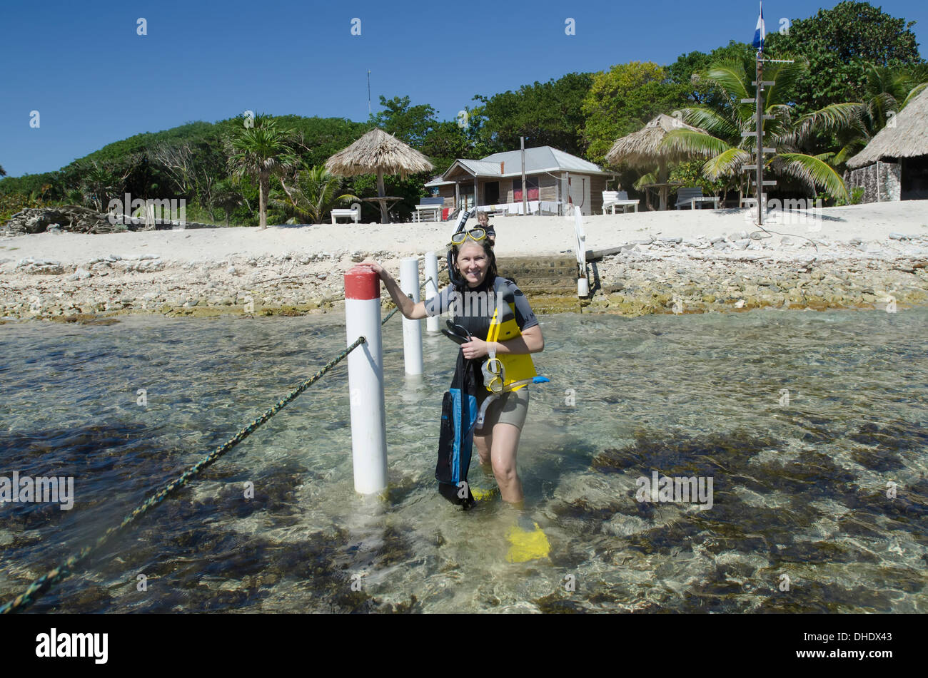A Woman With Snorkelling Gear At Utopia Village; Utila Island, Honduras Stock Photo