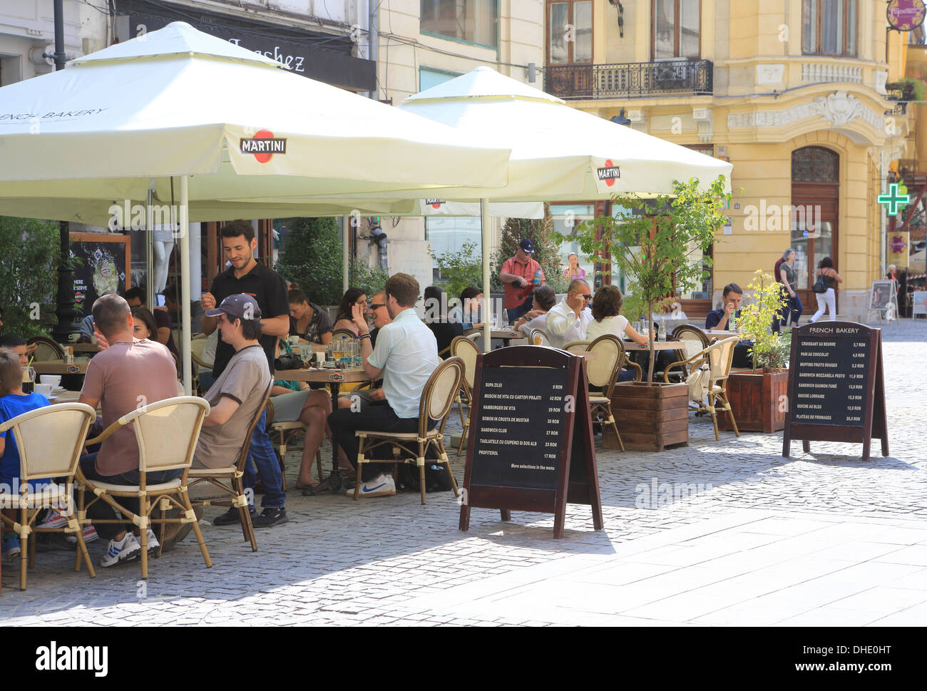 Busy cafes in the summer in Lipscani, the historical old town of Bucharest, Romania Stock Photo