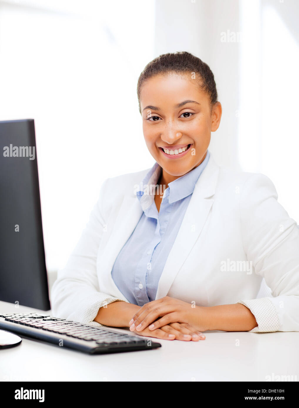african businesswoman with computer in office Stock Photo - Alamy