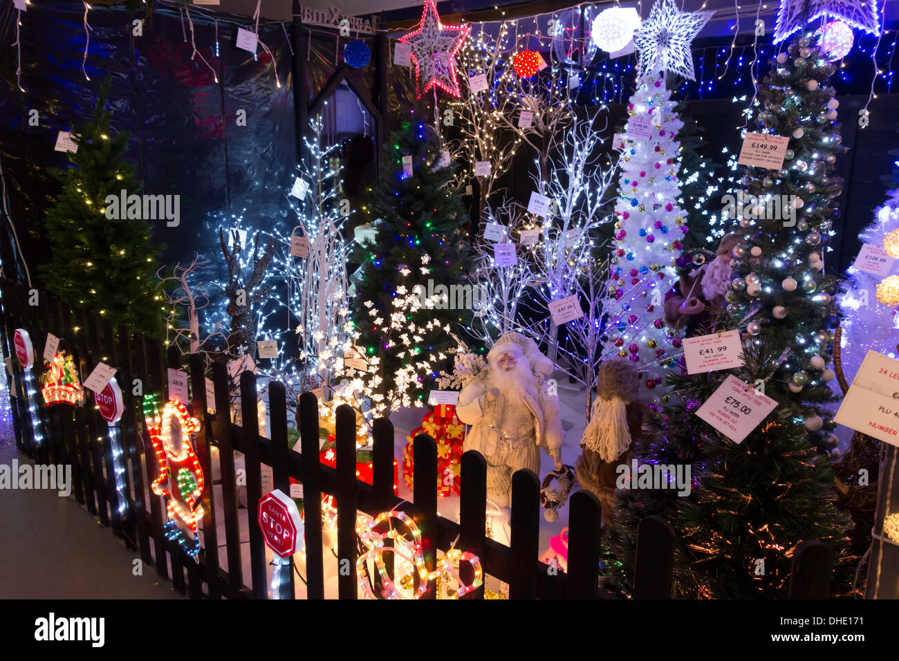 Display of illuminated Christmas Decorations for sale in a garden ...