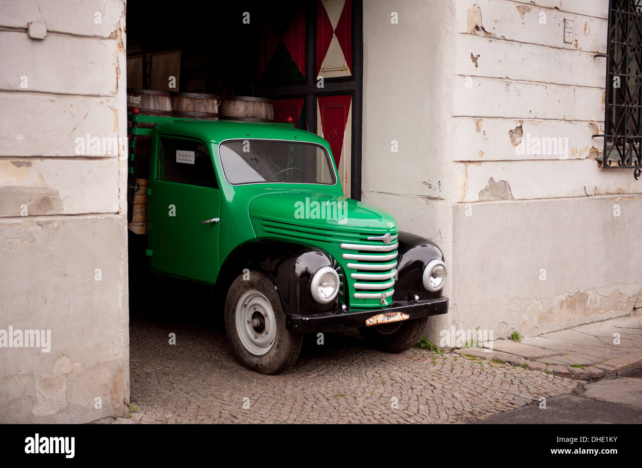 Vintage green and black car in entrance Stock Photo