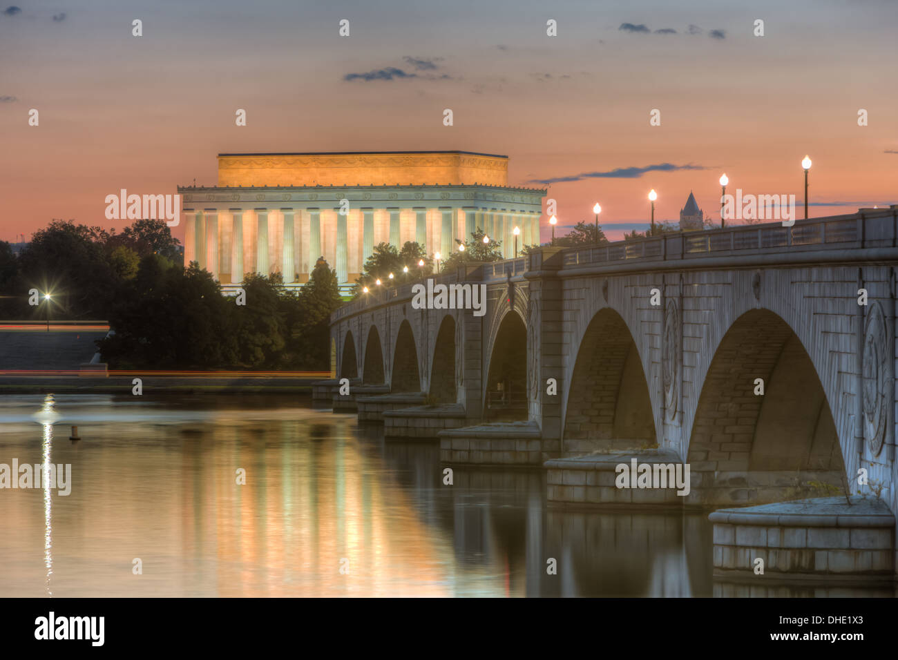 The Arlington Memorial Bridge spans the Potomac River leading to the Lincoln Memorial shortly before sunrise. Stock Photo