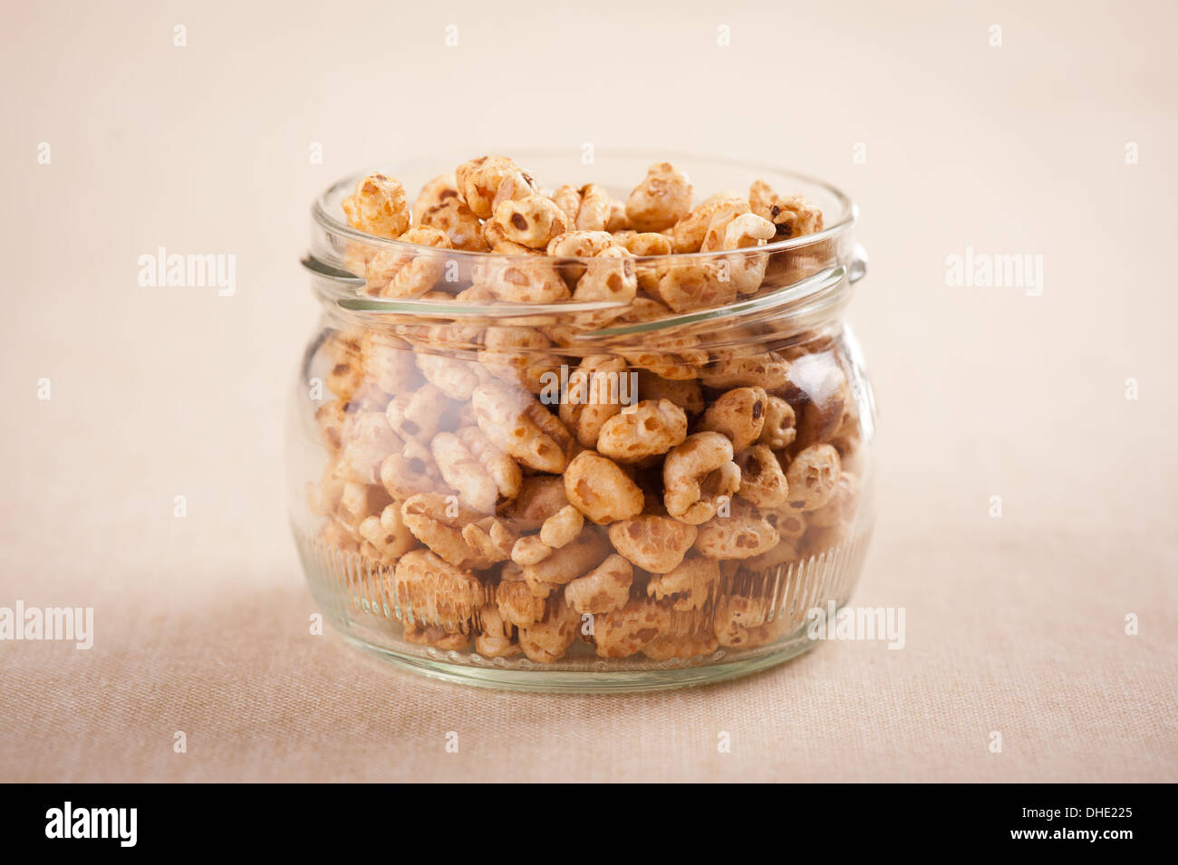 Popped wheat grains in glass jar Stock Photo - Alamy