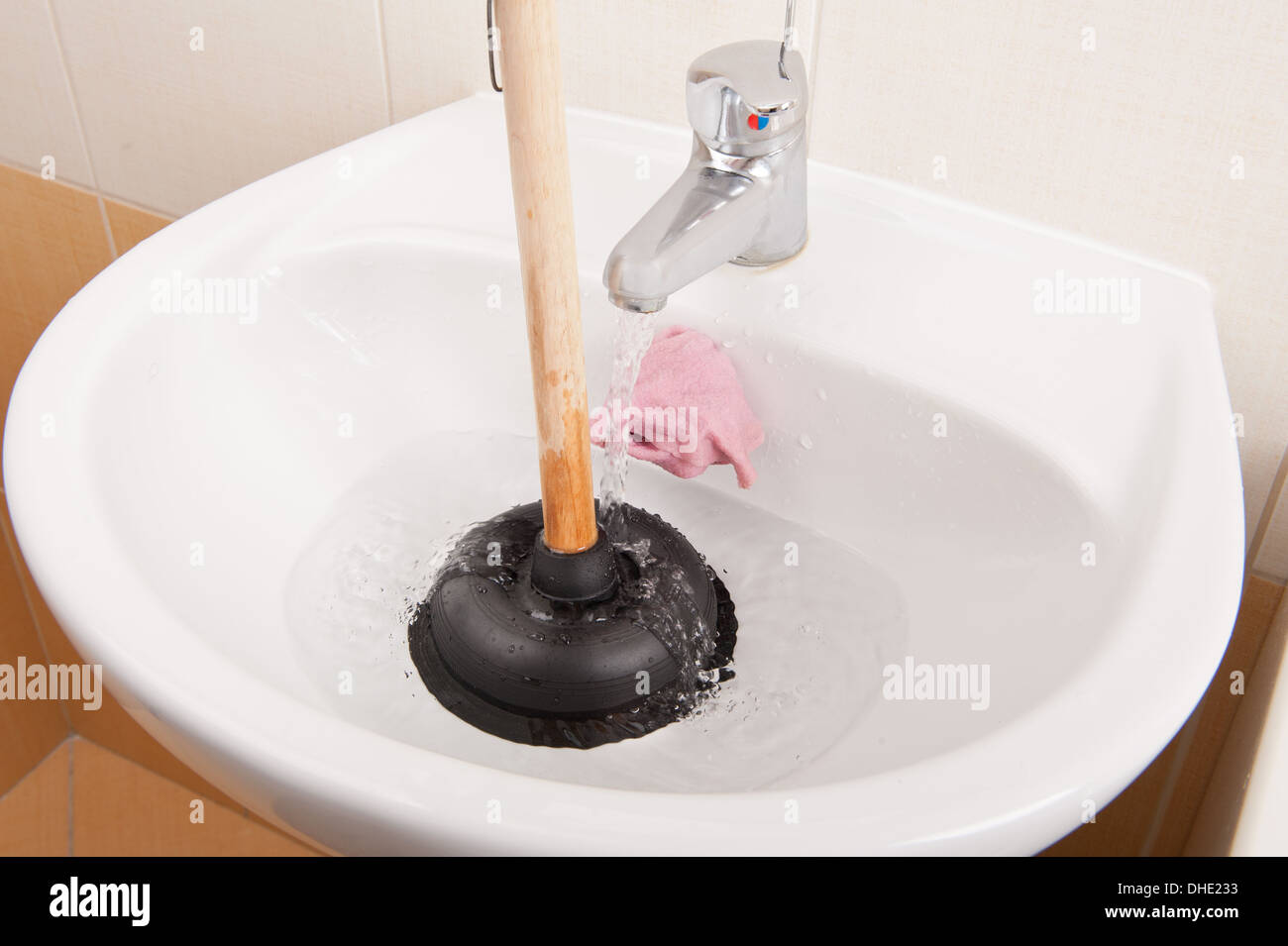Black Sink Plunger Tool In Bathroom Sink Stock Photo Alamy