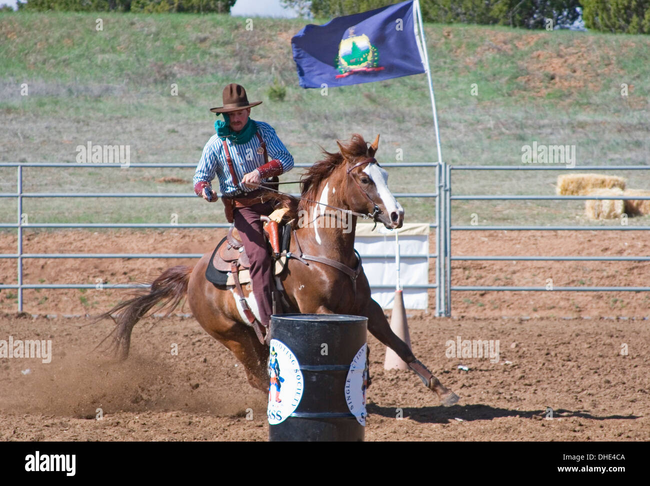 Cowboy with gun on horse, mounted shooting competition, End of Trail
