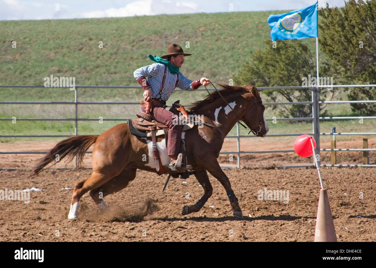 Cowboy on horse, mounted shooting competition, End of Trail Wild West Jubilee, near Albuquerque