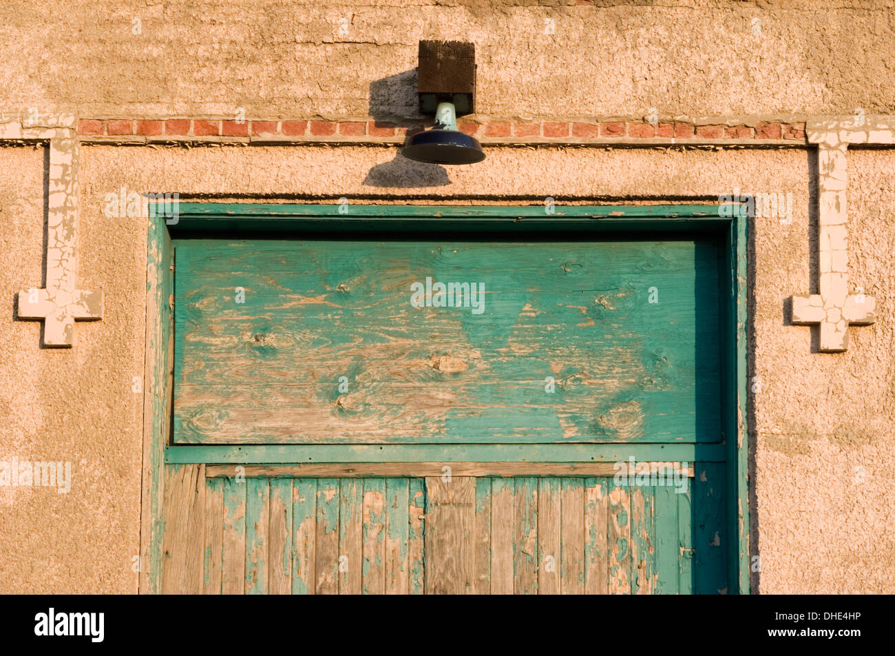 Faded green door, train station in Portales, New Mexico USA Stock Photo