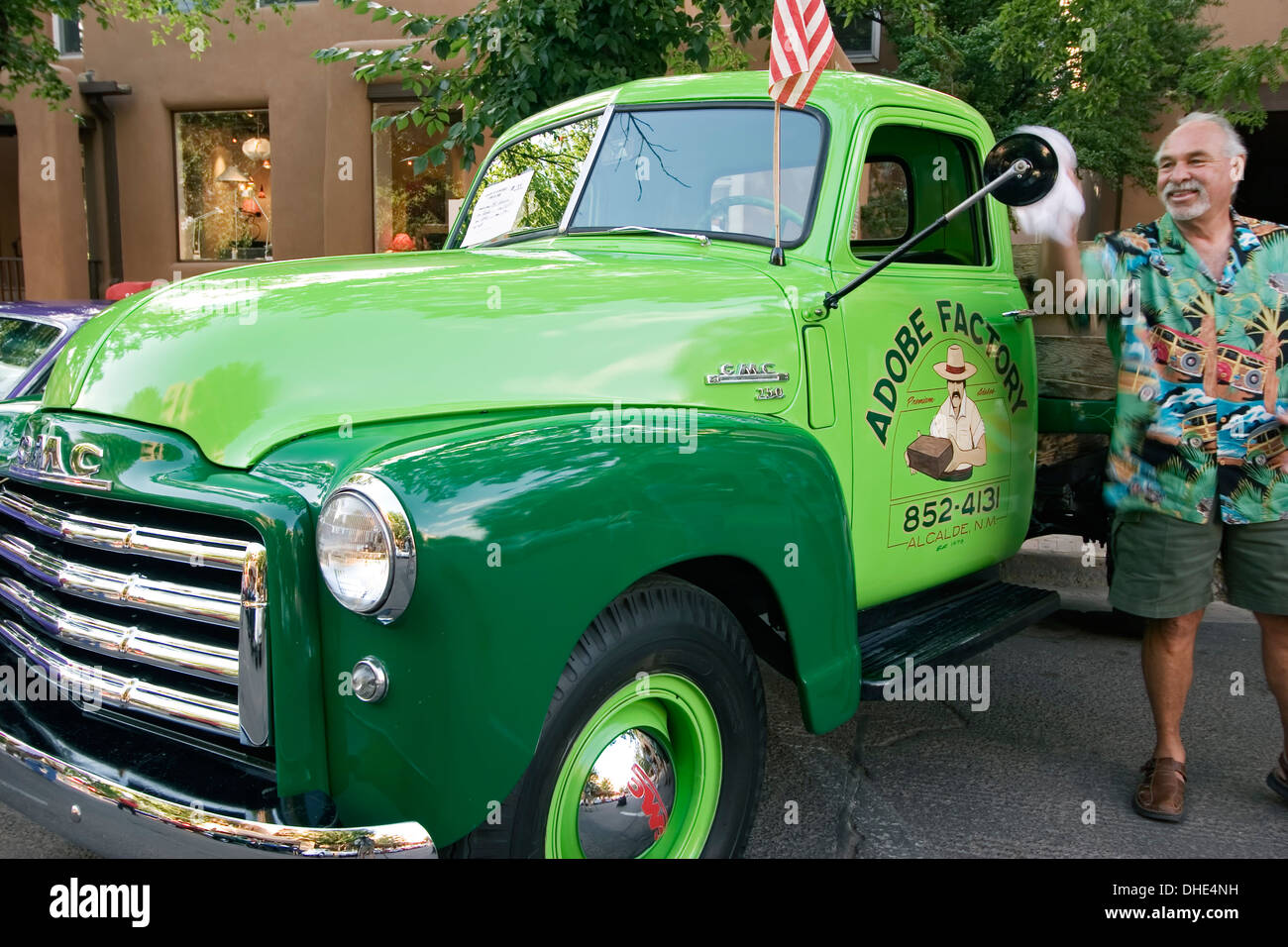 'Adobe Factory' antique GMC truck and owner, Pancakes on the Plaza Fourth of July Celebration, Santa Fe, New Mexico USA Stock Photo