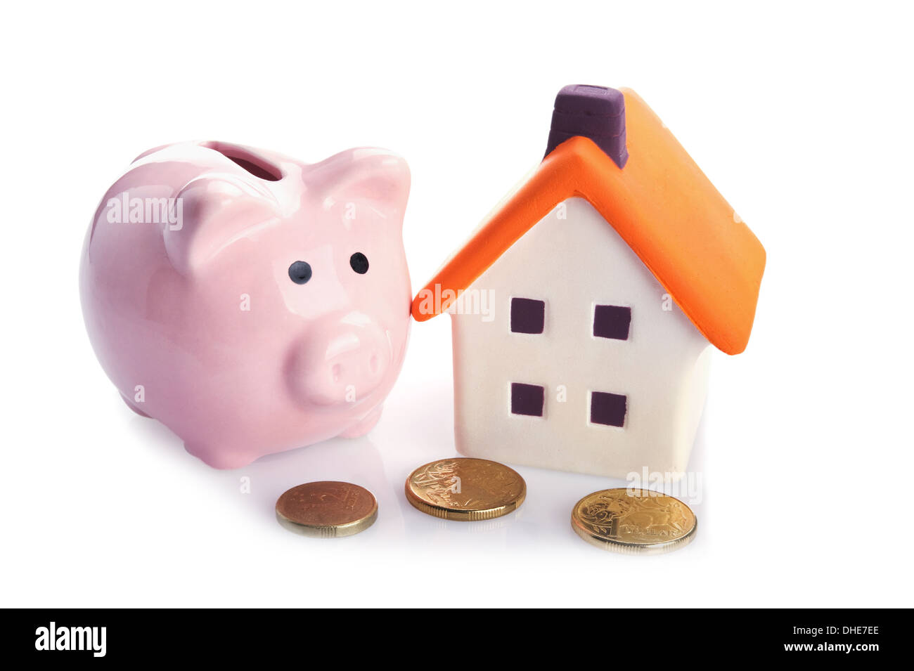 conceptual image with piggy bank, coin and house Stock Photo