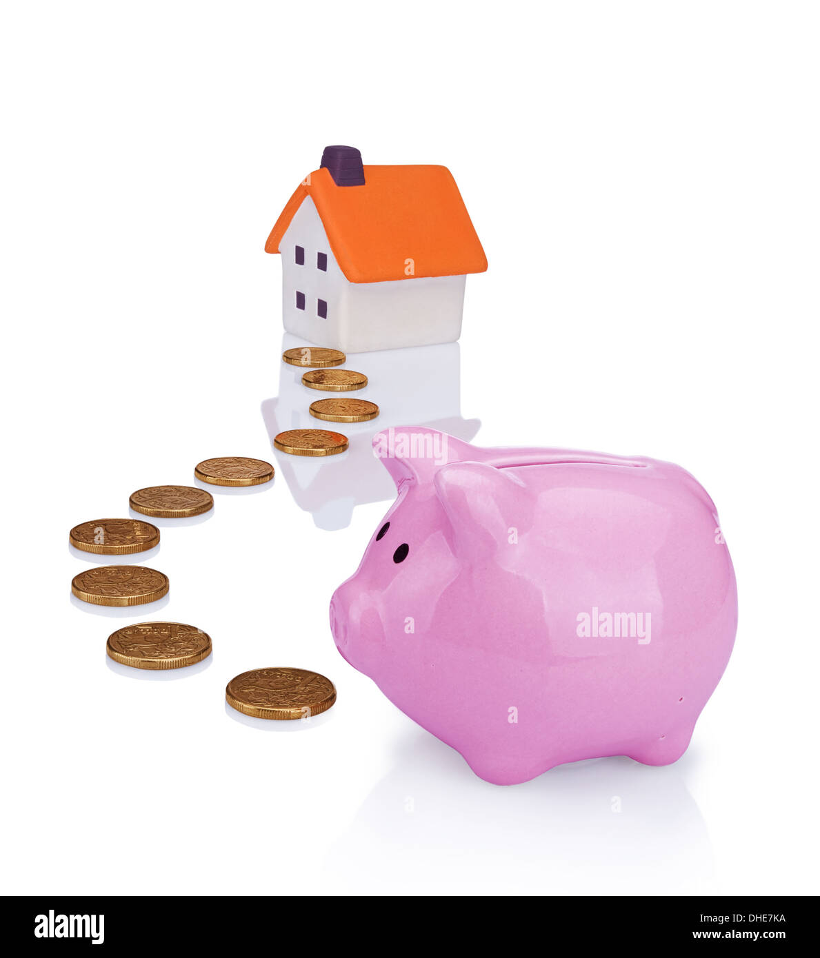 conceptual image with piggy bank, coin and house Stock Photo