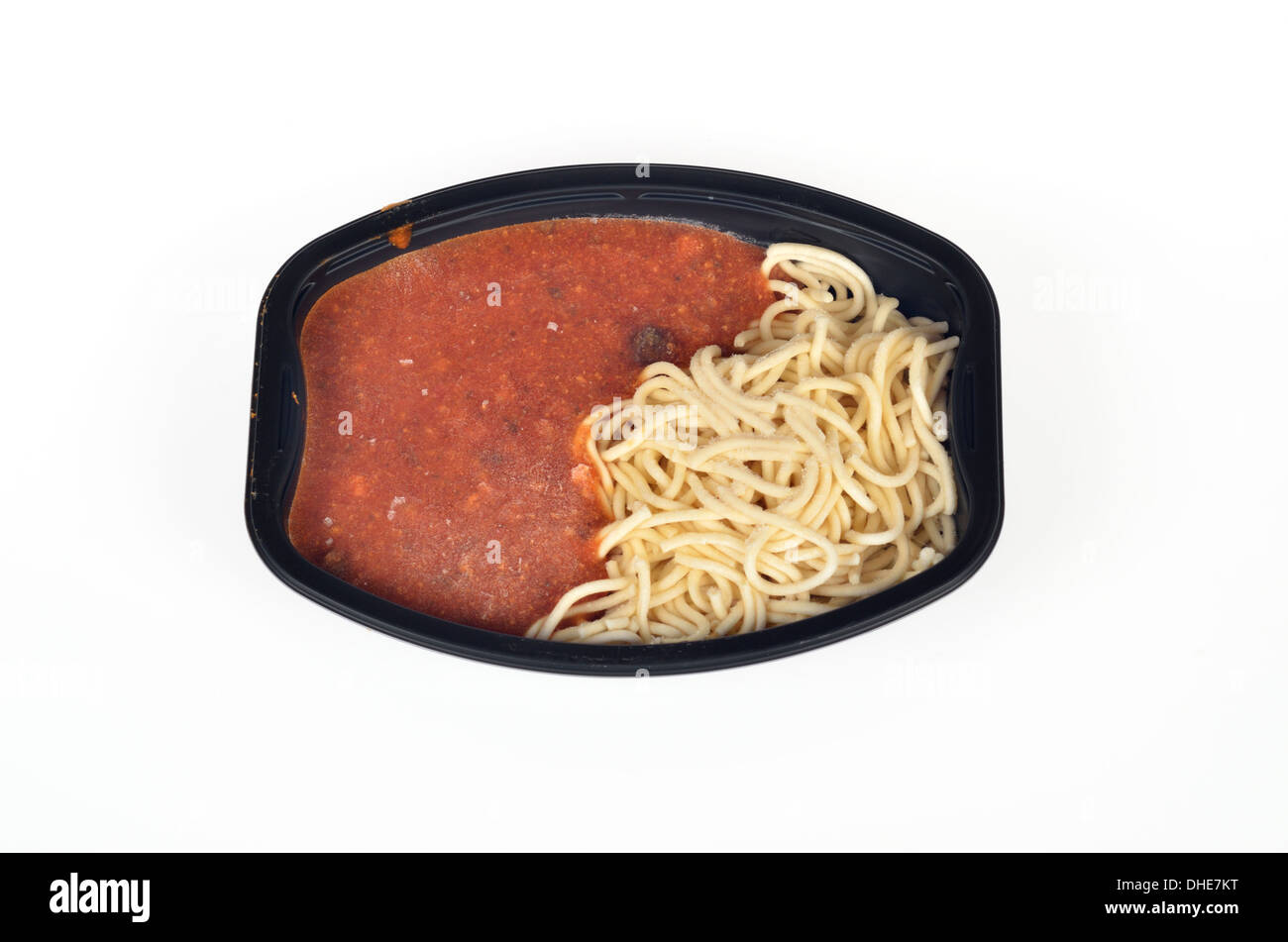 Frozen uncooked readymeal tray of spaghetti and meat sauce on white background, cutout. Stock Photo