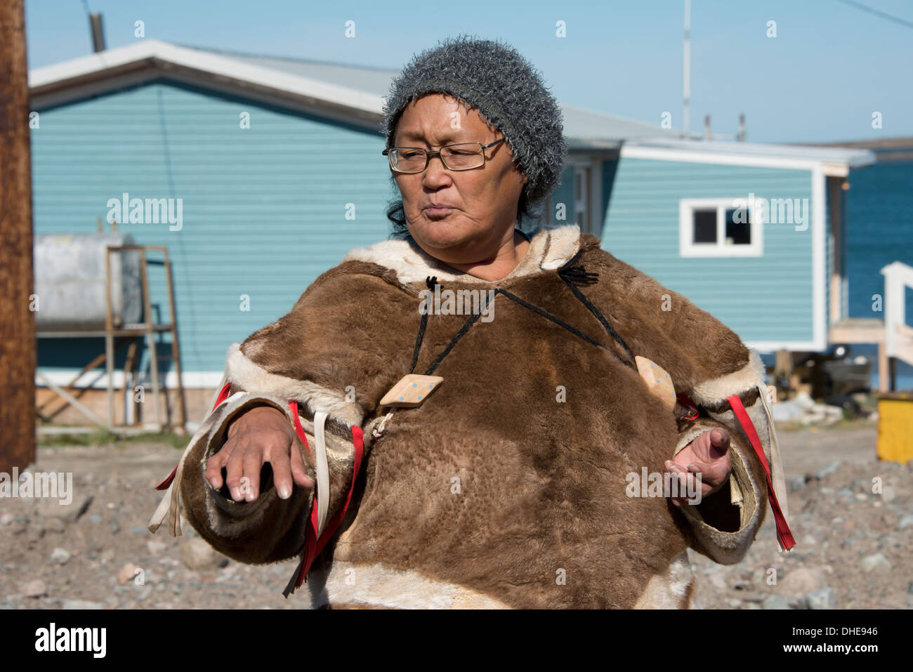 Canada, Nunavut, western shore of Hudson Bay, Kivalliq Region, Arviat. Inuit woman (Mary) in traditional attire. Stock Photo