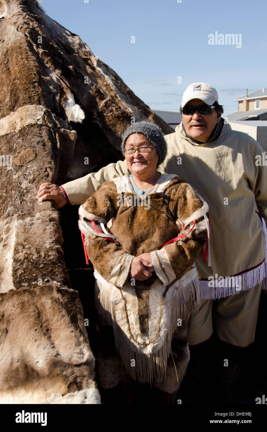 Canada, Nunavut, western shore of Hudson Bay, Kivalliq Region, Arviat. Inuit couple (Mary & Peter) in traditional arctic attire. Stock Photo