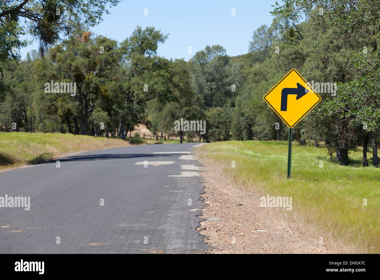 Right turn sign on rural road - California USA Stock Photo