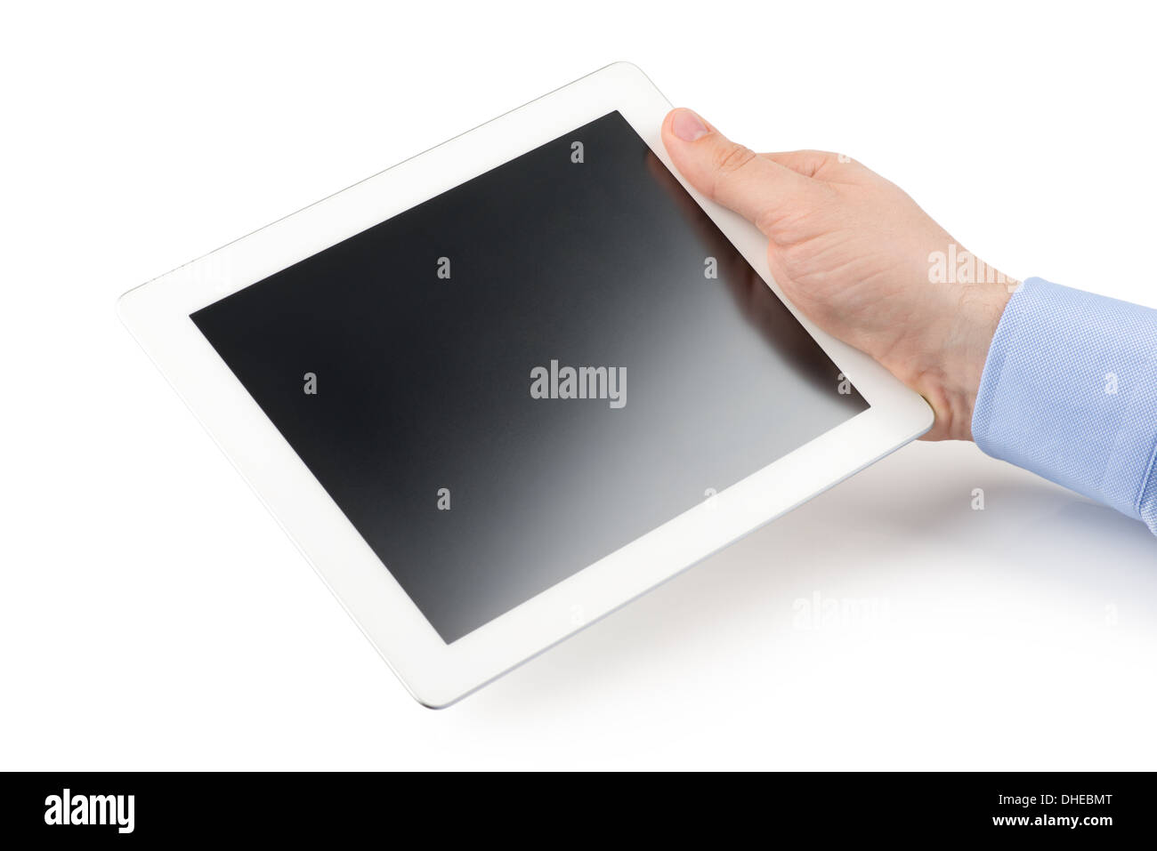 Man's right hand holding a tablet computer on a white background. Stock Photo