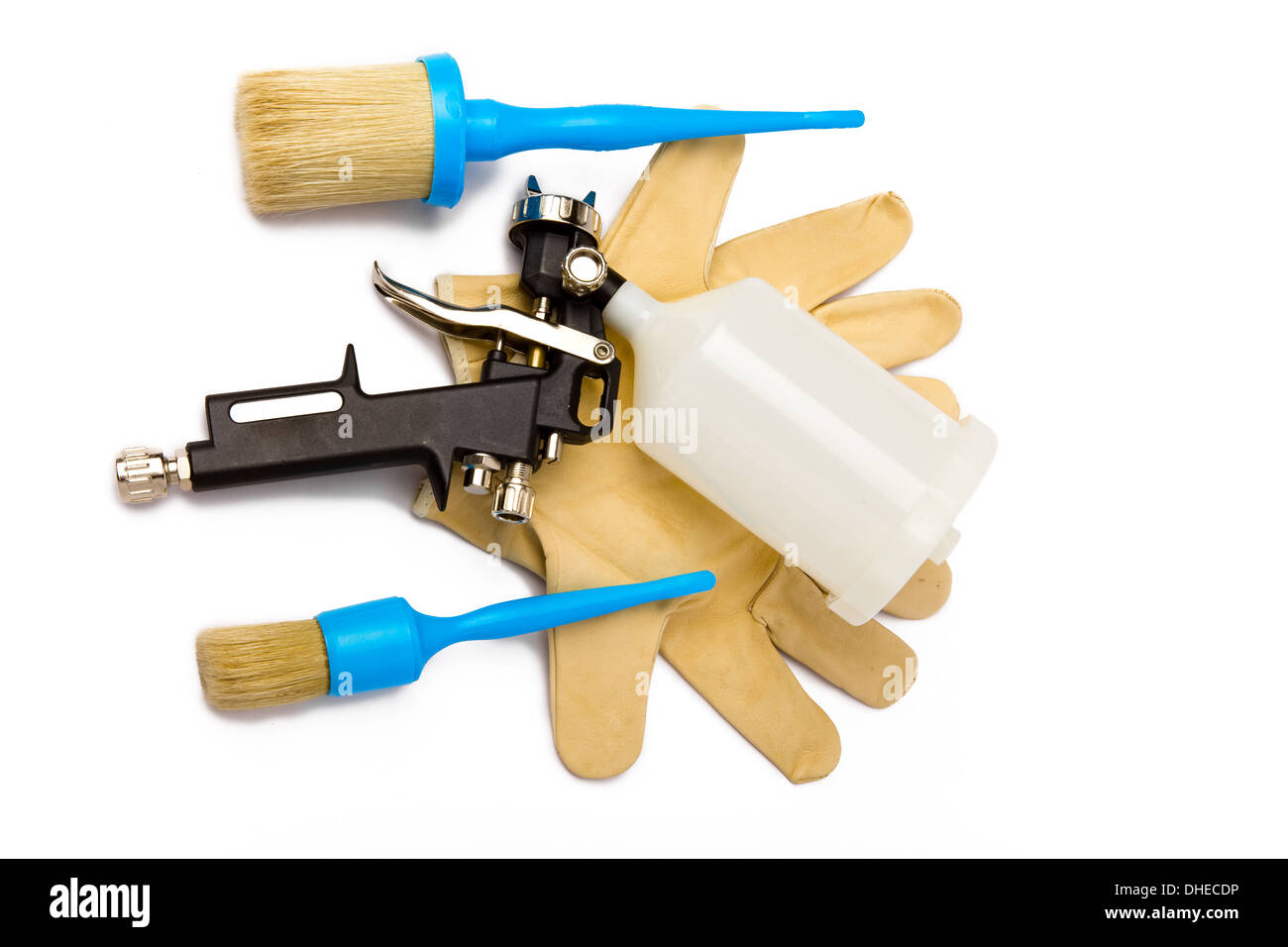 spray gun, working gloves and brushes Stock Photo Alamy