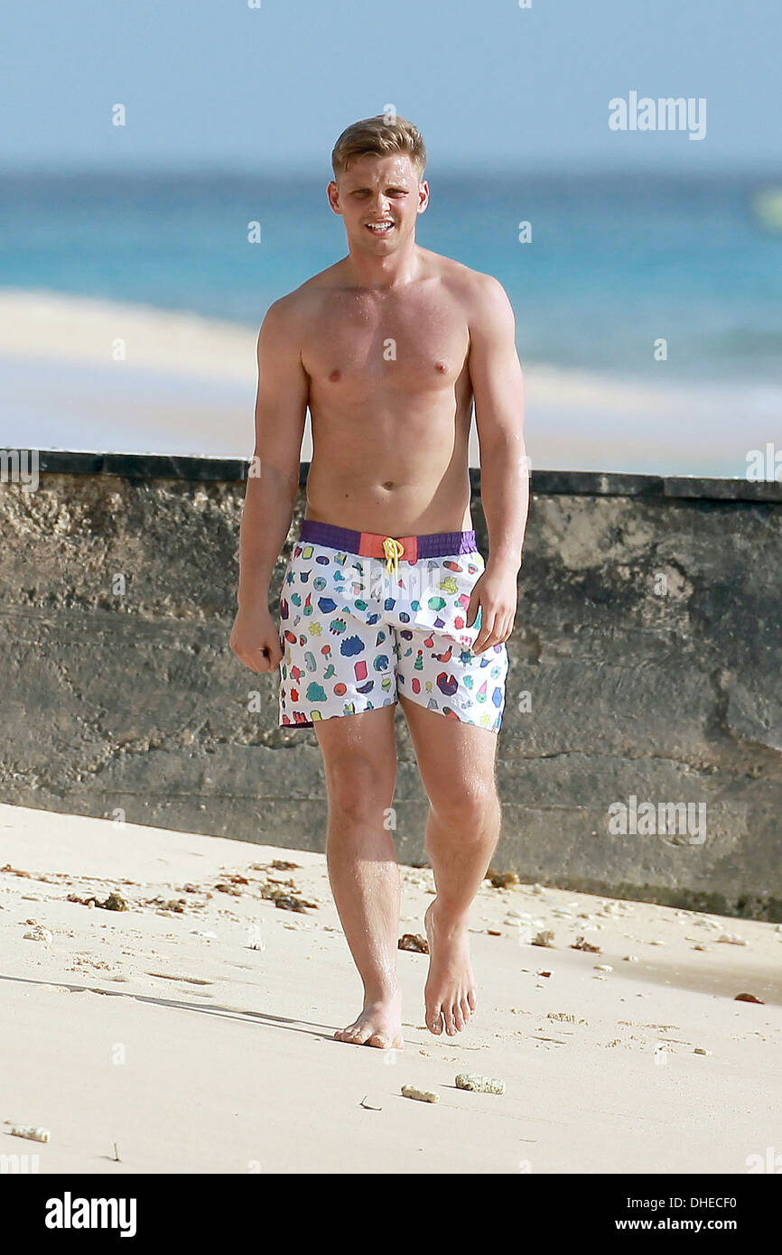Jeff Brazier takes a walk along a beach and prepares to go for a swim