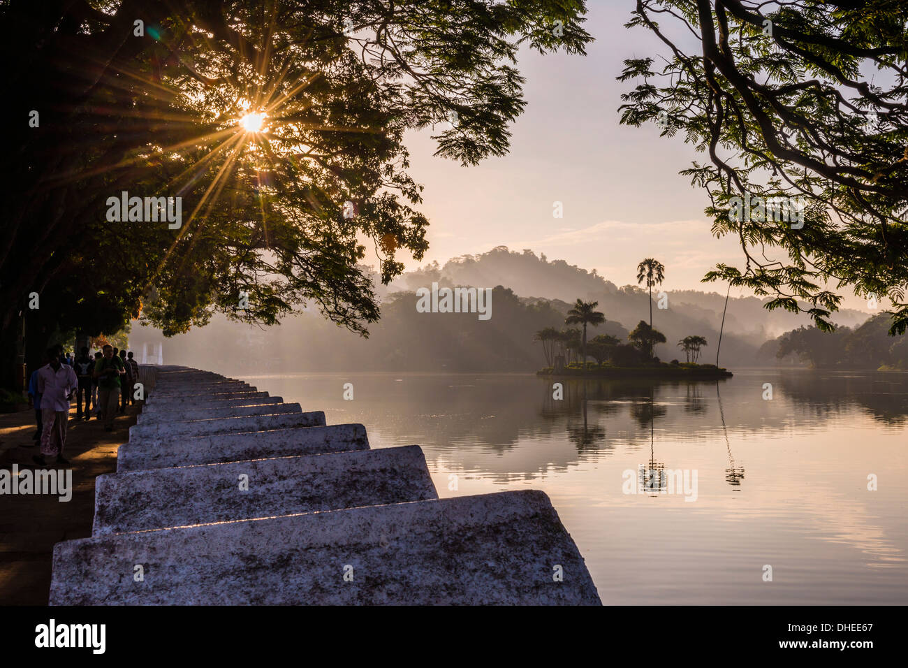 Sunrise at Kandy Lake and the island which houses the Royal Summer House, Kandy, UNESCO, Central Province, Sri Lanka Stock Photo