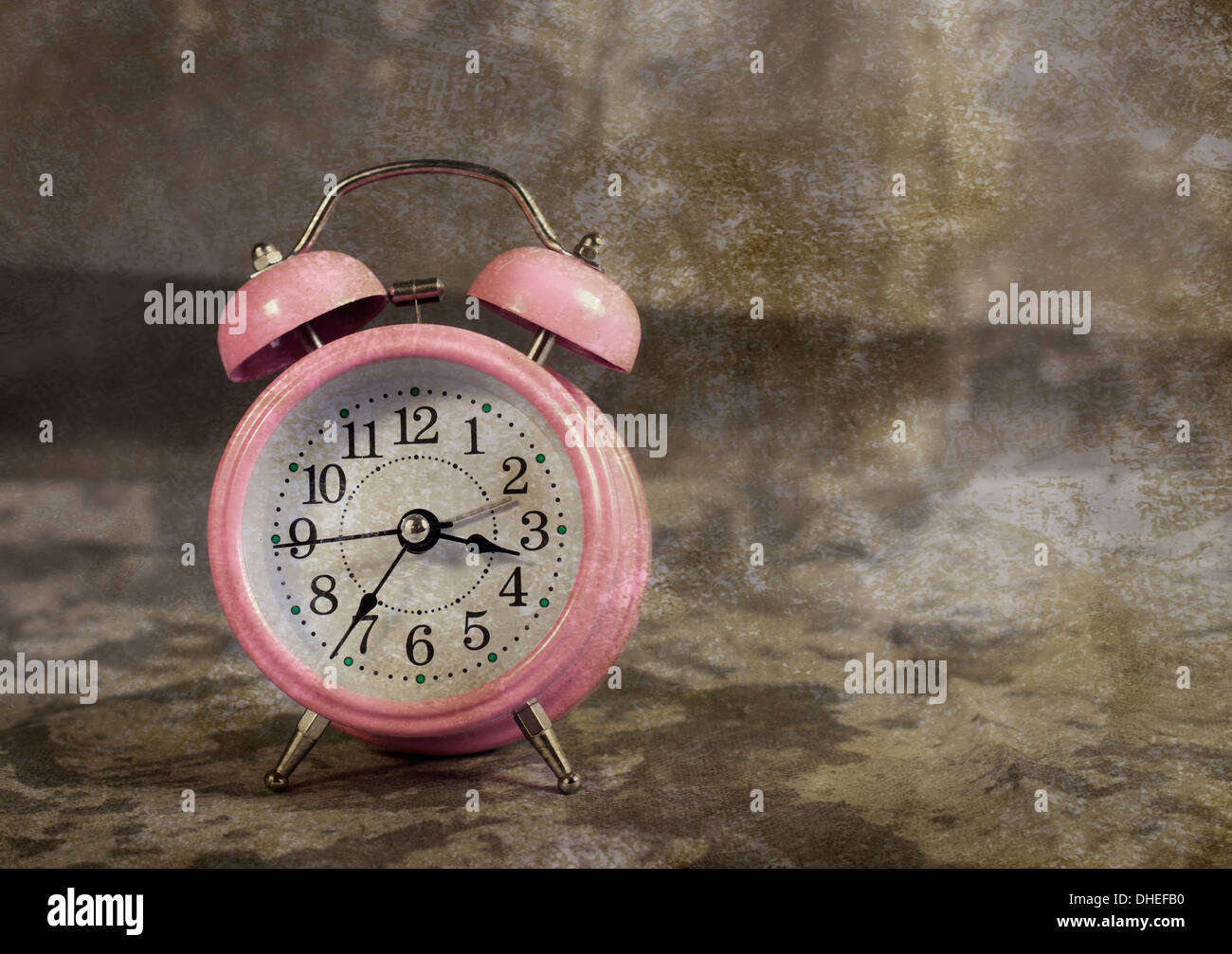 Retro pink alarm clock with vintage background Stock Photo Alamy
