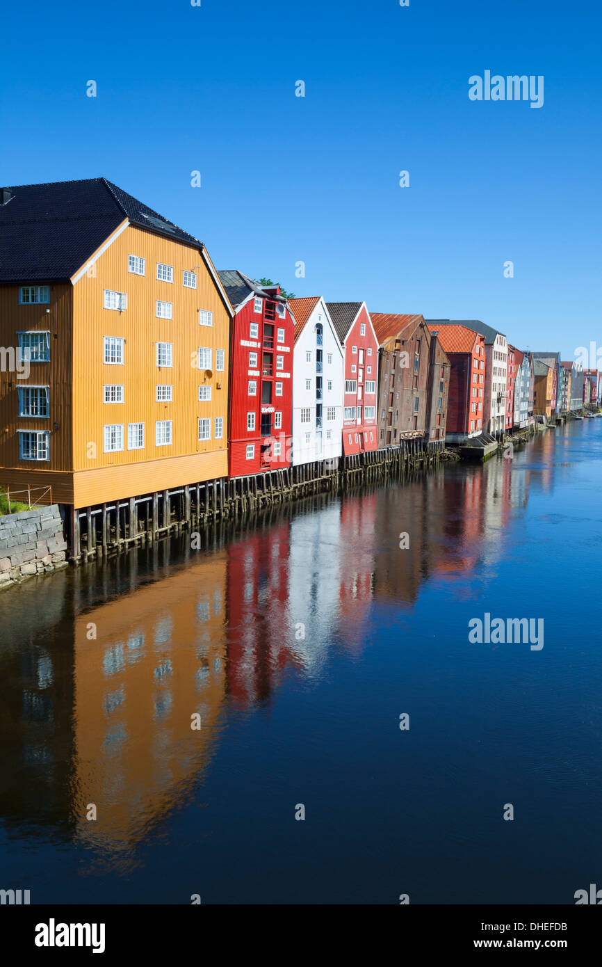 Old fishing warehouses reflected in the River Nidelva, Trondheim, Sor-Trondelag, Norway, Scandinavia, Europe Stock Photo