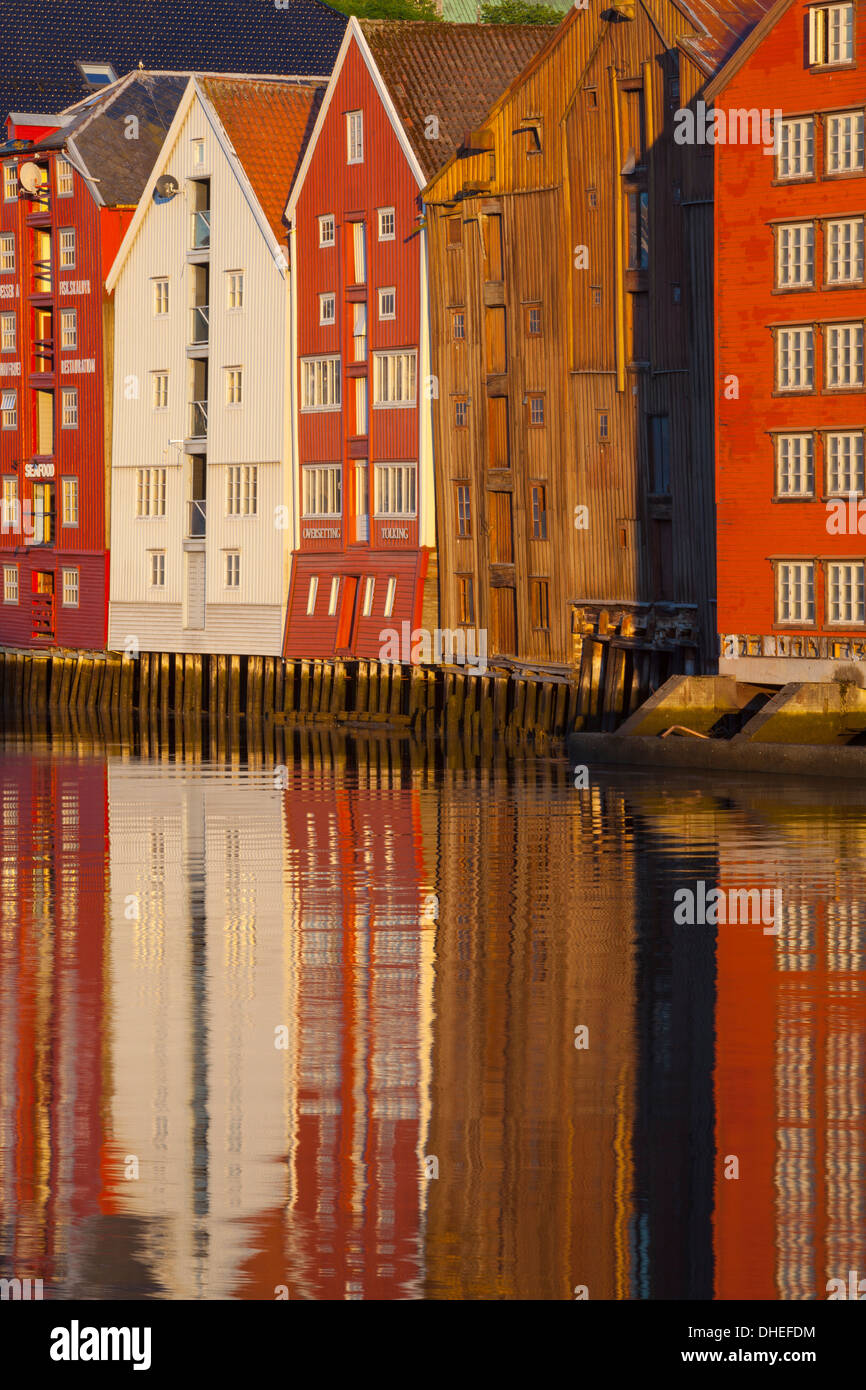 Old fishing warehouses reflected in the River Nidelva, Trondheim, Sor-Trondelag, Norway, Scandinavia, Europe Stock Photo