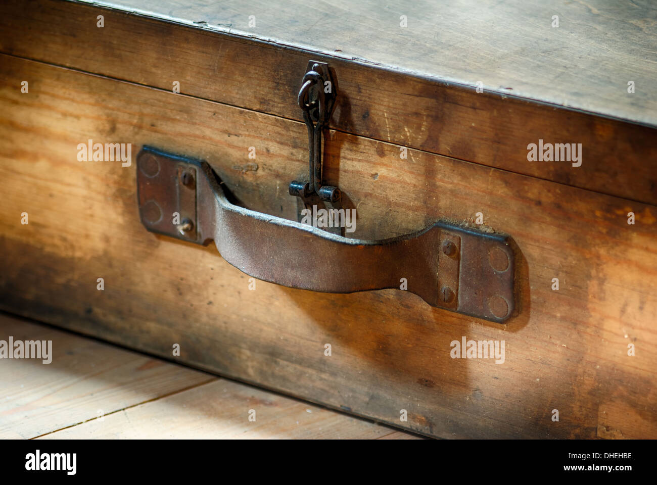 Wooden suitcase on an attic Stock Photo Alamy