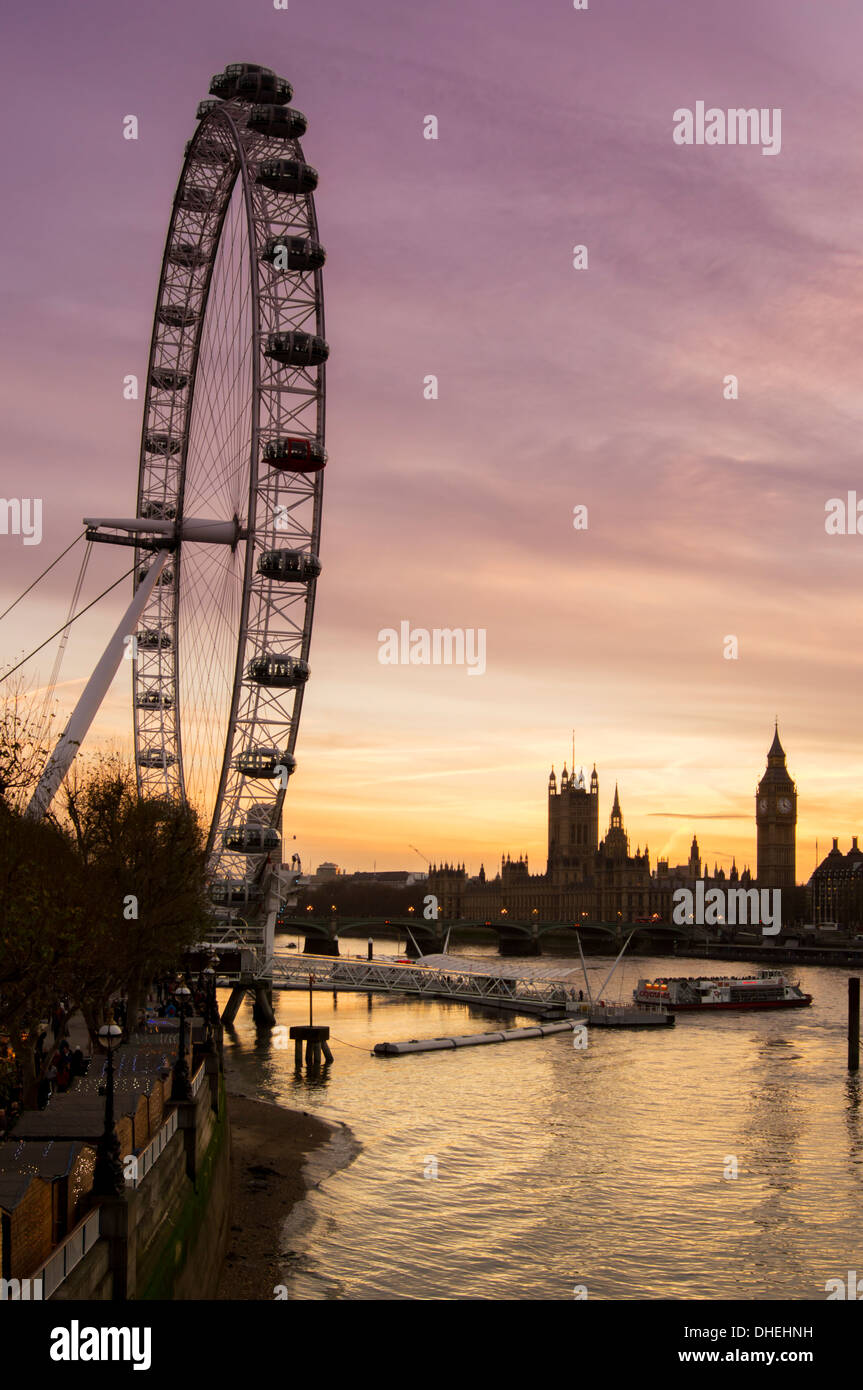 Victoria Tower, Big Ben, Houses of Parliament and London Eye by the River Thames at dusk, London, England, United Kingdom Stock Photo