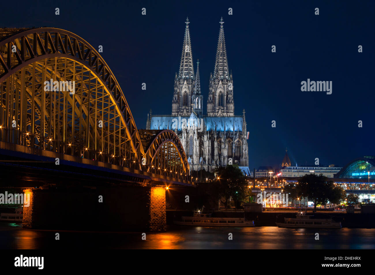 Cologne cathedral, UNESCO World Heritage Site, and Hohenzollern bridge at dusk, Cologne, Germany, Europe Stock Photo