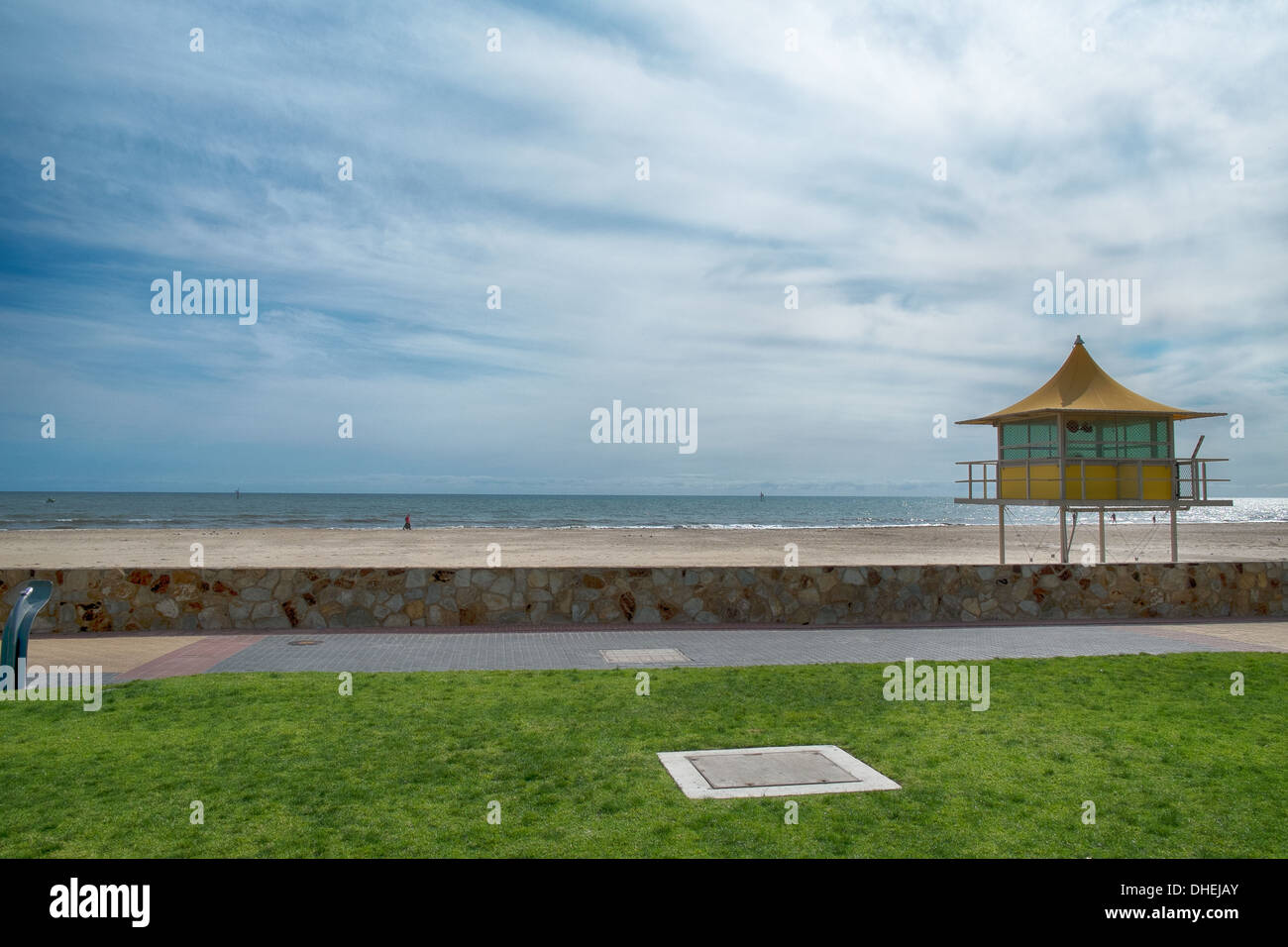 Lifeguards watch out from a surf life saving tower on an Australian beach in Glenelg, Adelaide. Stock Photo
