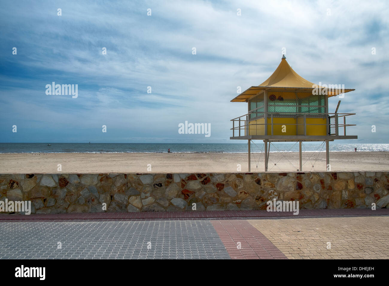 Lifeguards watch out from a surf life saving tower on an Australian beach in Glenelg, Adelaide. Stock Photo