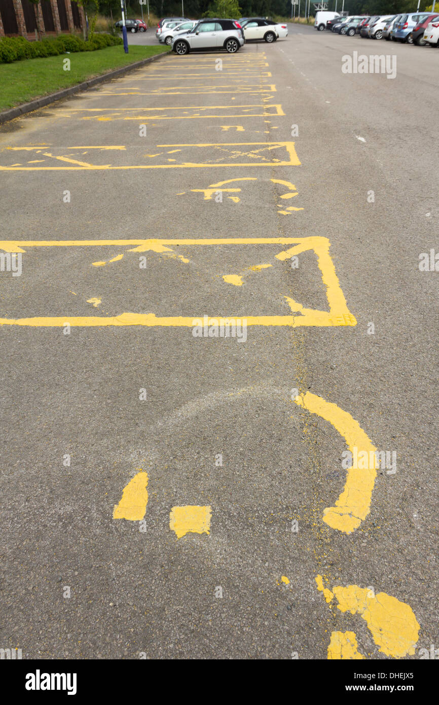 Unused car parking spaces for disabled drivers at Lostock railway station car park, Bolton. Stock Photo