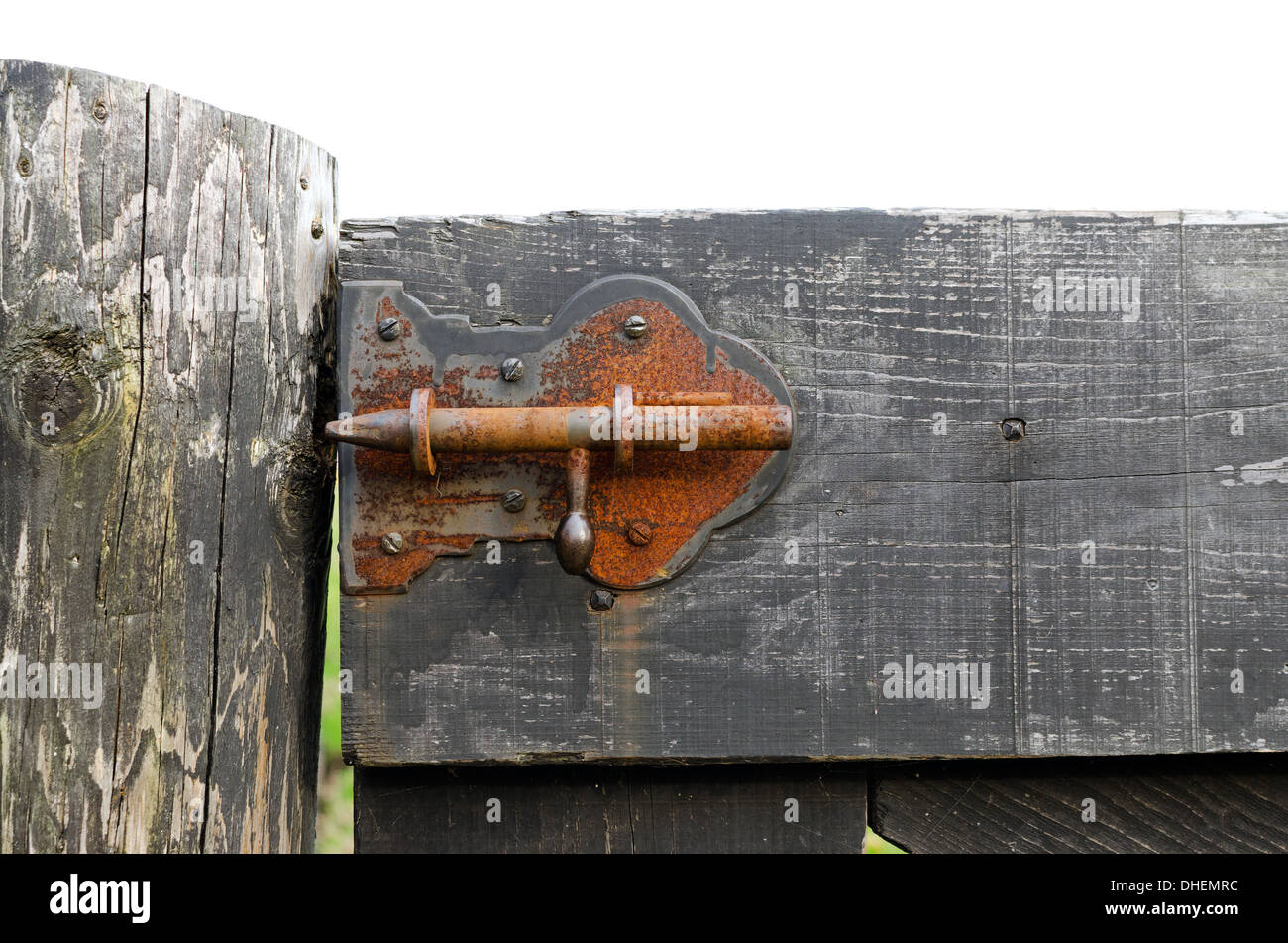 Old rusty barn latch in a wooden door Stock Photo