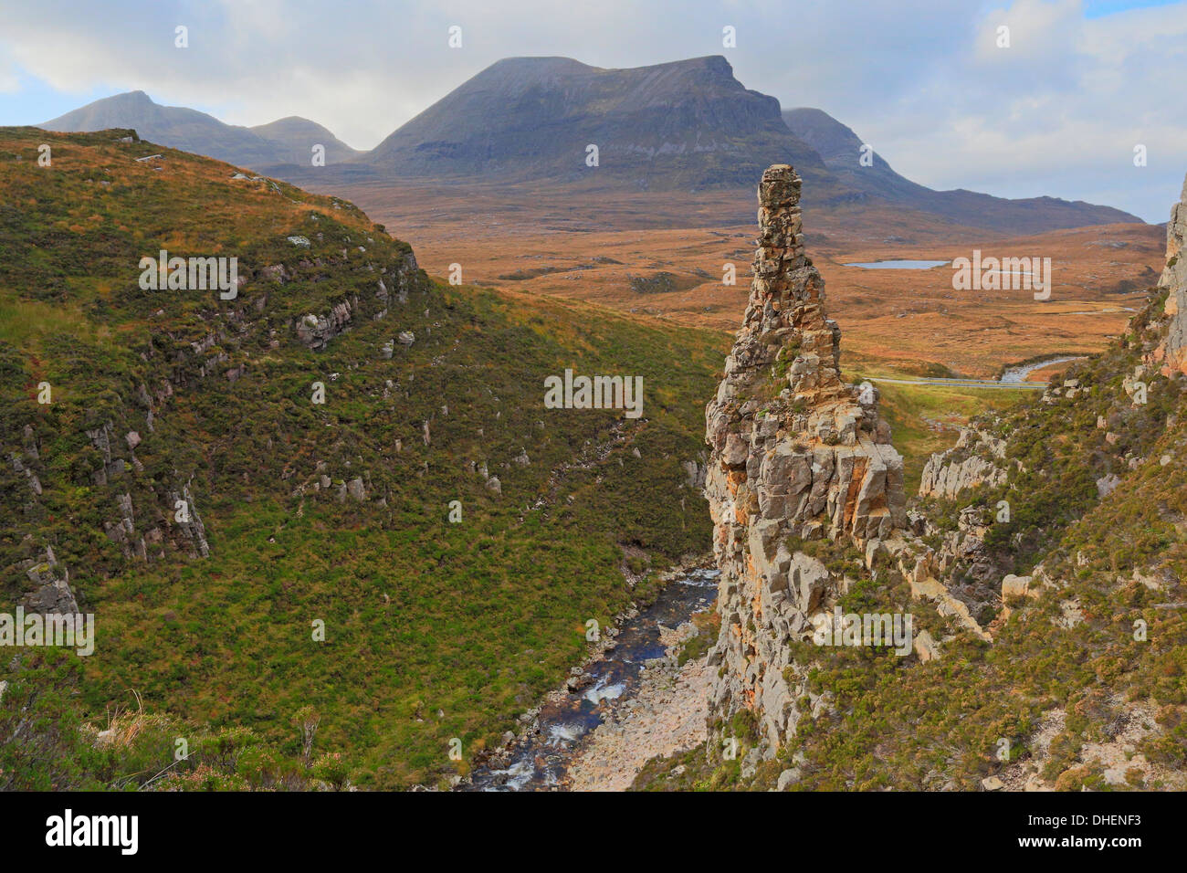 Sandstone pinnacle with Quinag in the distance in the autumn Stock Photo