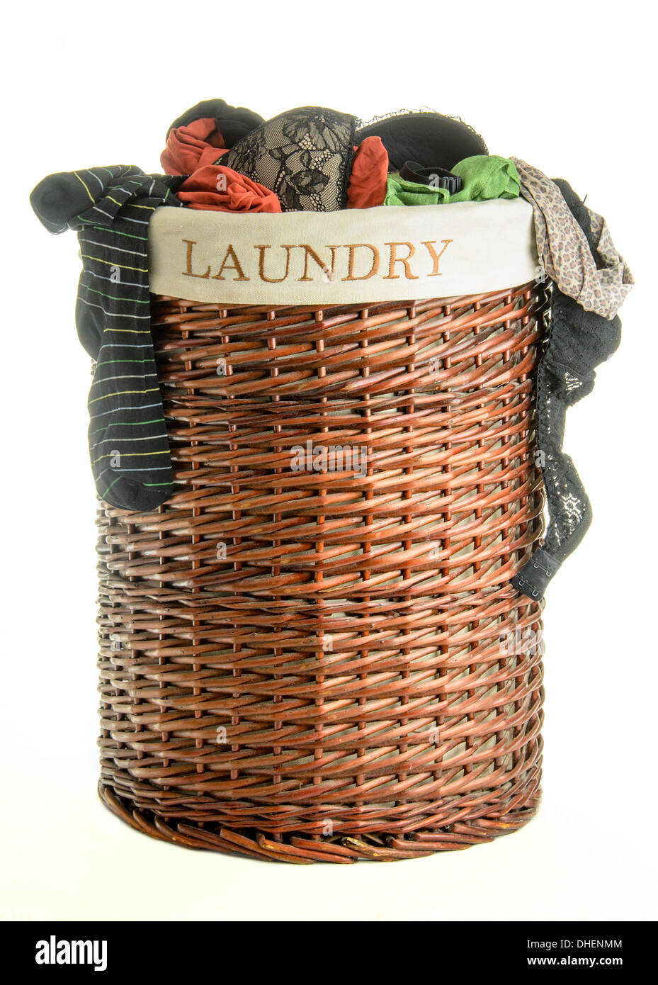 Laundry basket with clothes isolated on white Stock Photo Alamy