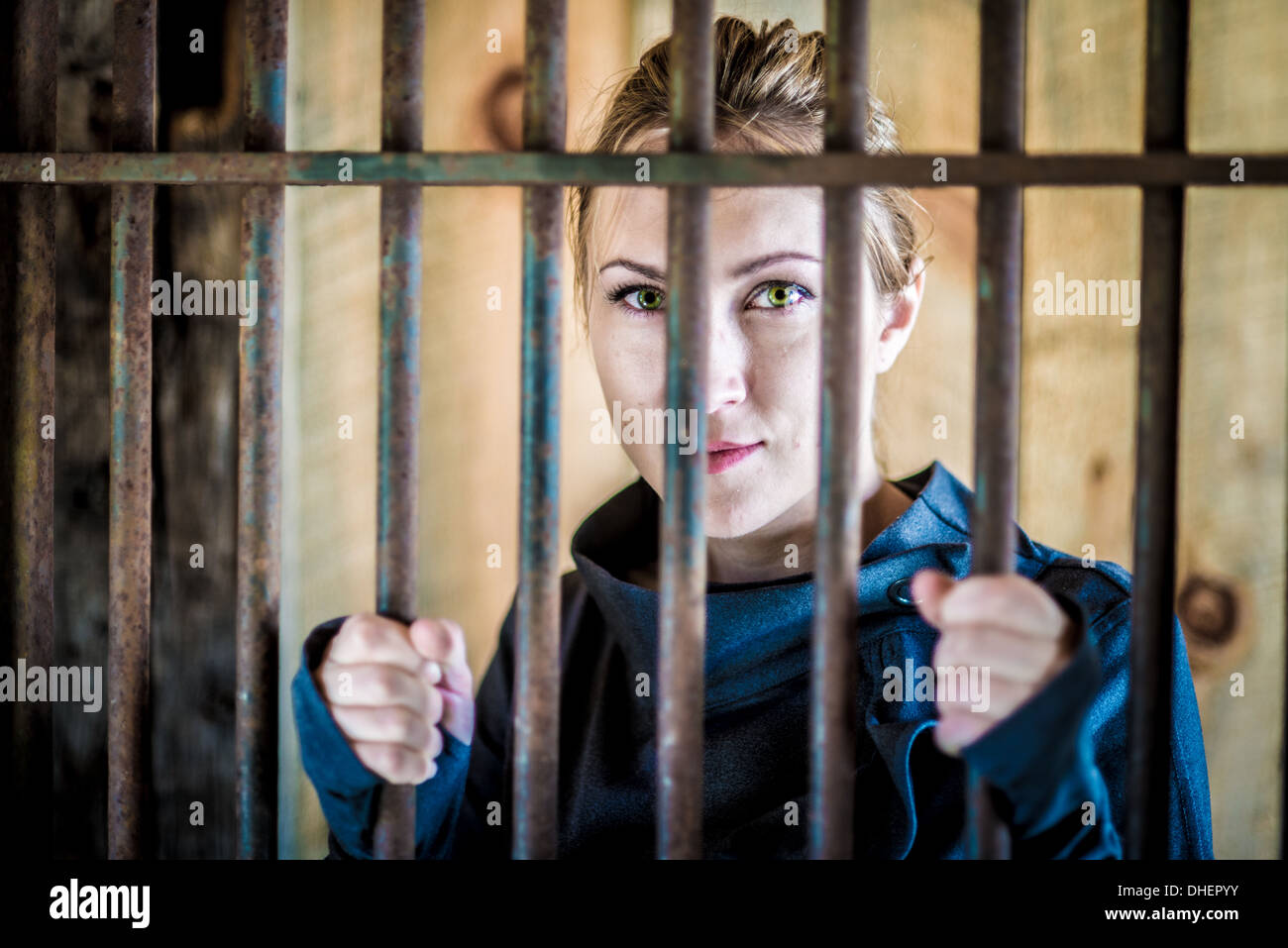 Woman behind bars Stock Photo