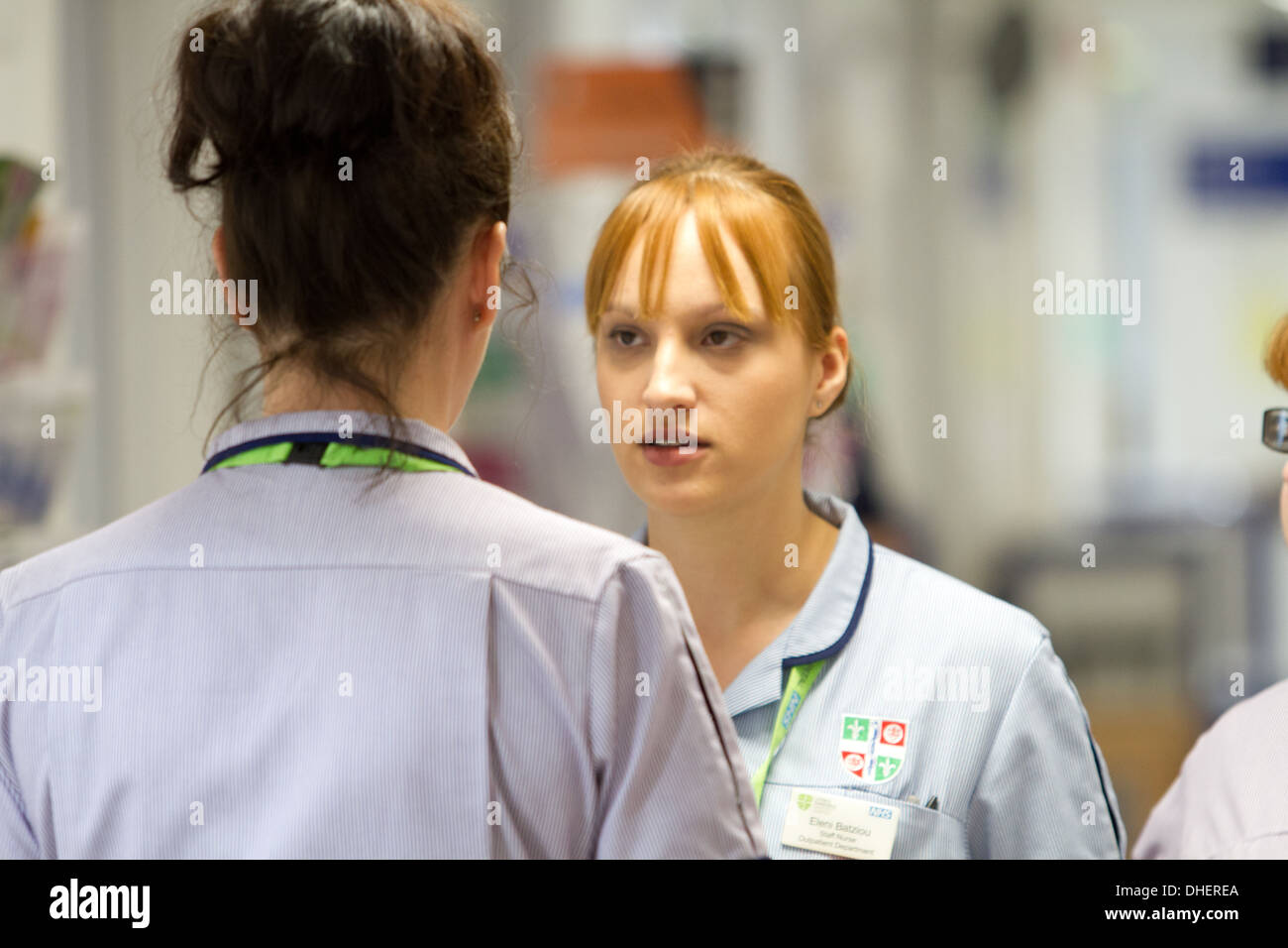 Nurses in discussion on an NHS hospital ward UK Stock Photo