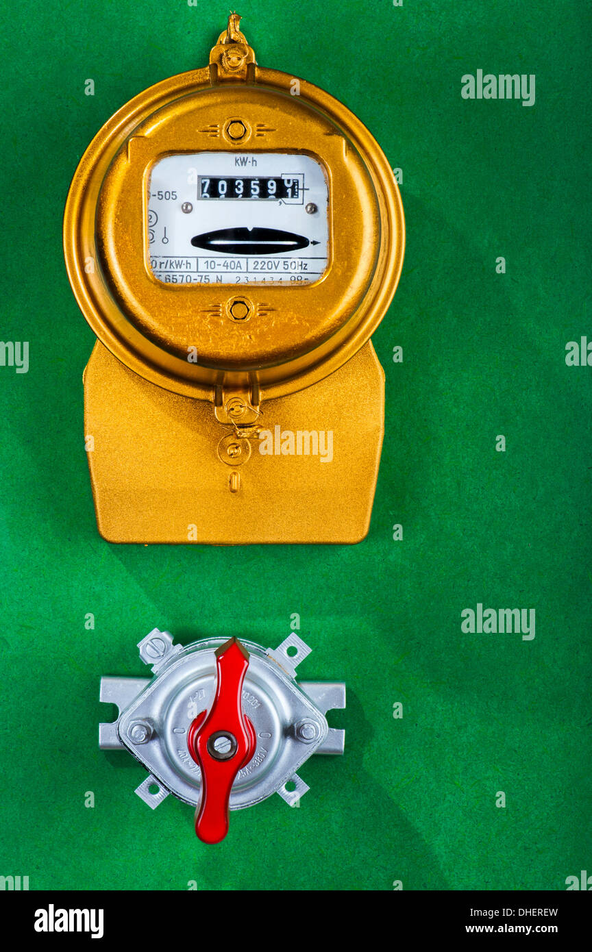 Golden retro electric meter with toggle switch Stock Photo Alamy