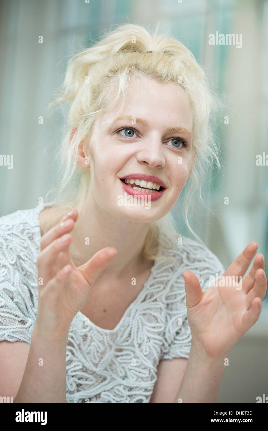 Young woman in conversation Stock Photo