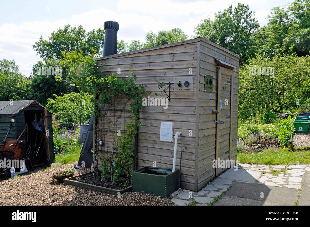 Compost toilet or lavatory with stench or ventilation pipe showing at rear Alexandra Palace Allotments Haringey London England Britain UK Stock Photo