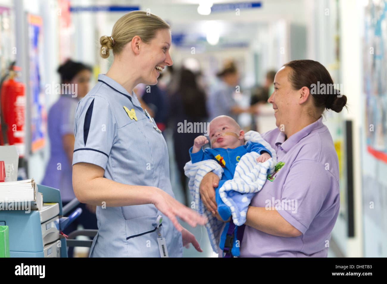 A pediatric nurse and care worker look after a baby UK Stock Photo Alamy