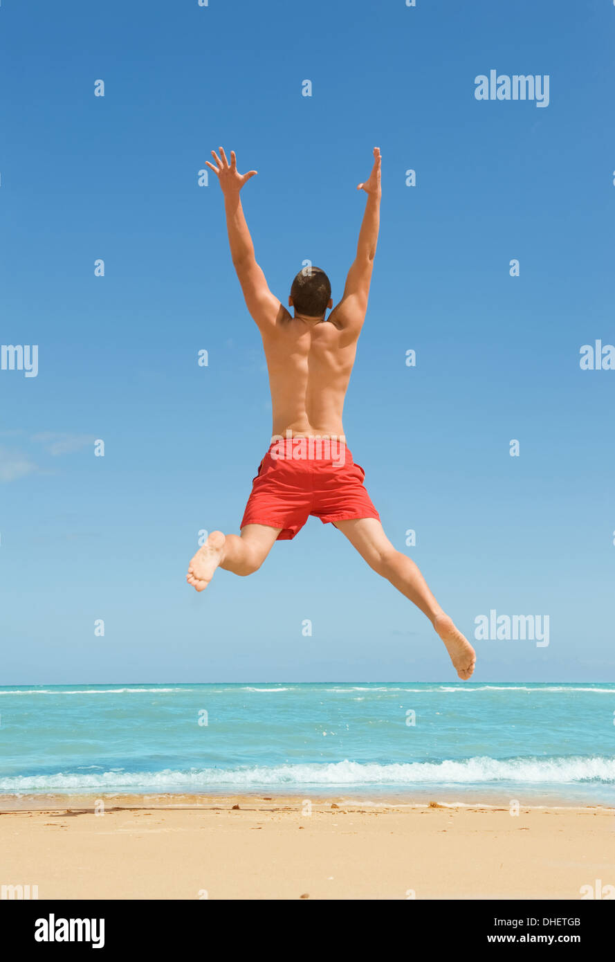 man jumping on the beach Stock Photo Alamy