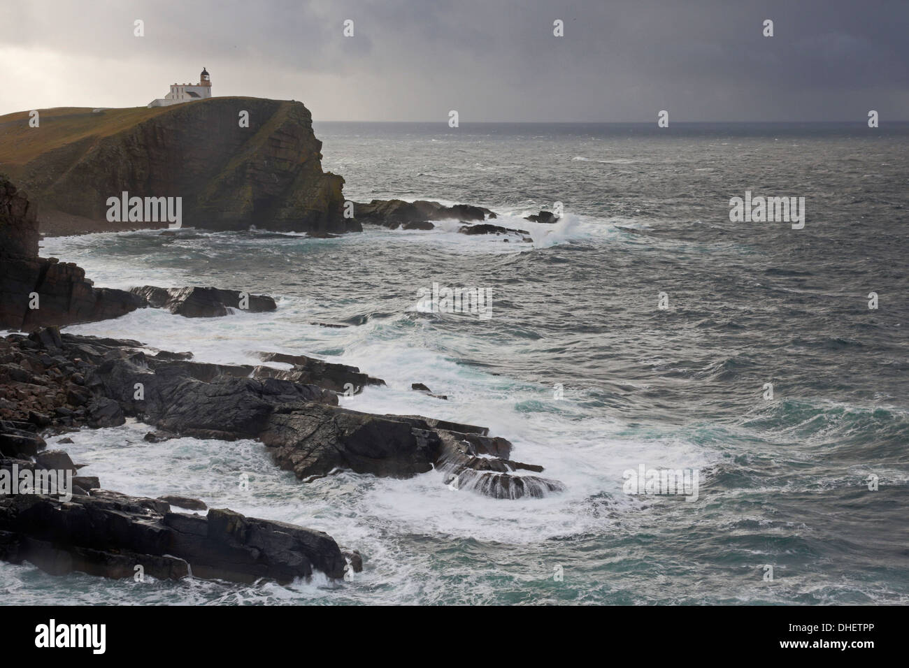 Stoer Lighthouse and coast in a storm Stock Photo